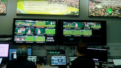 Staff monitor game data and work on match analysis at an operations room during the Wimbledon Tennis Championships in London, Wednesday, July 3, 2019.