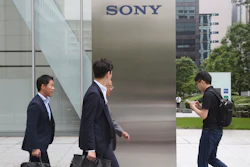 In this July 9, 2019, photo, people walk in front of the headquarters of Sony Corp., in Tokyo.