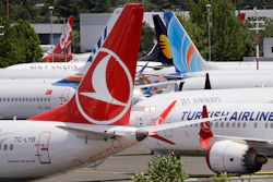 In this June 27, 2019, file photo, dozens of grounded Boeing 737 Max airplanes parked adjacent to Boeing Field in Seattle.