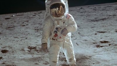In this July 20, 1969 photo made available by NASA, astronaut Buzz Aldrin, lunar module pilot, walks on the surface of the moon during the Apollo 11 extravehicular activity.