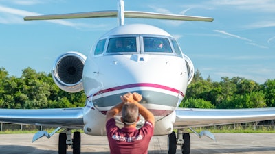 This Thursday, July 11, 2019, photo, provided by Chris Garrison, shows a Gulfstream aircraft on the tarmac after its record-breaking around-the-world flight.