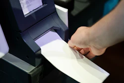 In this June 13, 2019, photo, Steve Marcinkus, an Investigator with the Office of the City Commissioners, demonstrates the ExpressVote XL voting machine at the Reading Terminal Market in Philadelphia.