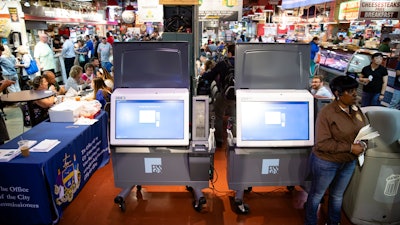 In this Thursday, June 13, 2019, photo, ExpressVote XL voting machines are displayed during a demonstration at the Reading Terminal Market in Philadelphia.