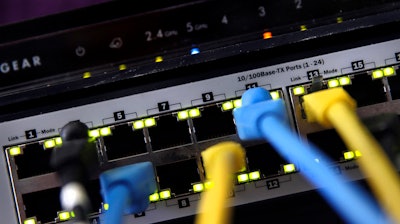 In this June 19, 2018, file photo, a router and internet switch are displayed in East Derry, N.H.