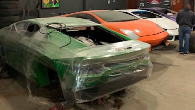 This July 15, 2019 photo released by Itajai Civil Police, shows car molds of luxury car replicas at a workshop in Itajai, Brazil. Brazilian police dismantled a clandestine workshop run by a father and son who assembled fake Ferraris and Lamborghinis to order, in Brazil's southern state of Santa Catarina.