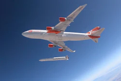 This Wednesday, July 10, 2019, photo shows a rocket being released from under the wing of a Boeing 747 during a test flight in Mojave, Calif.