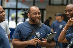 In this Friday, July 19, 2019, photo, Dennis Sigur (left), Nicholas Jackson (center) and Joshua Lewis participate in Tennessee State University’s coding and app development initiative in Nashville.