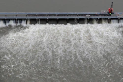 In this May 10, 2019, file photo, workers open bays of the Bonnet Carré Spillway in Norco, La.