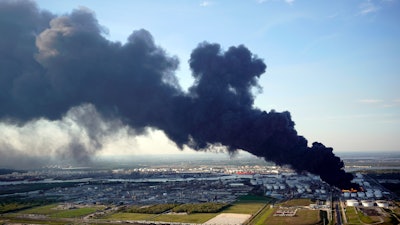 In this March 18, 2019, file photo, a plume of smoke rises from a petrochemical fire at the Intercontinental Terminals Company in Deer Park, Texas.