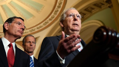 Senate Majority Leader Mitch McConnell speaks to reporters following the weekly policy lunches on Capitol Hill, Tuesday, July 23, 2019.