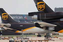In this June 24, 2019, photo, workers prepare to unload a UPS aircraft after it arrived at Dallas-Fort Worth International Airport in Grapevine, Texas.