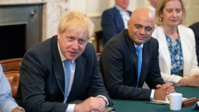 Prime Minister Boris Johnson, left, holds his first Cabinet meeting with Chancellor of the Exchequer Sajid Javid and Secretary for Work and Pensions Amber Rudd, right, at Downing Street in London, Thursday July 25, 2019.