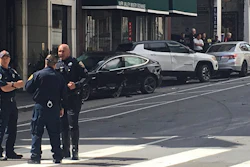 This Sunday, July 21, 2019, file photo shows the scene after a woman was arrested after running a red light in a rented Tesla in San Francisco.