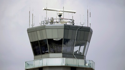 This March 12, 2013 photo shows the air traffic control tower at Chicago's Midway International Airport. The Department of Homeland Security plans to issue a security alert Tuesday for small planes, warning that modern flight systems are vulnerable to hacking if someone manages to gain physical access to the aircraft. A DHS alert recommends that plane owners ensure they restrict unauthorized physical access to their aircraft until the industry develops safeguards to address the issue, which was discovered by Boston-based cybersecurity company, Rapid7, and reported to the federal government.