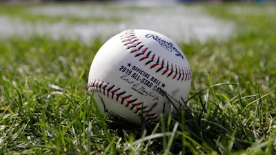 A baseball is pictured as the American League warms-up for the MLB baseball All-Star Game, Tuesday, July 9, 2019, in Cleveland. Faced with a record onslaught of home runs and pitchers convinced baseballs are juiced, Commissioner Rob Manfred says the sport has been unable to find any changes in the manufacturing process.