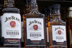 In this July 9, 2018, file photo, Bottles, Jim Beam are displayed at Rossi's Deli in San Francisco. The company behind the world's top-selling bourbon, Jim Beam, is pouring tens of millions of dollars into a new Kentucky distillery to boost production of craft whiskeys.
