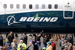 In this Feb. 5, 2018, file photo a Boeing 737 MAX 7, the newest version of Boeing's fastest-selling airplane, is displayed during a debut for employees and media of the new jet in Renton, Wash. Boeing says it's providing $100 million over several years to help families and communities affected by two crashes of its 737 Max plane that killed 346 people. The company said Wednesday, July 3, 2019, that some of the money will go toward living expenses and to cover hardship suffered by the families of dead passengers.