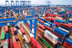 In this Tuesday, May 14, 2019, photo, containers are piled up at a port in Qingdao in east China's Shandong province. China's imports from the United States plunged 31.4% in June from a year earlier amid a tariff war with Washington, while exports to the U.S. market sank 7.8%, Customs data showed Friday, July 12, 2019.