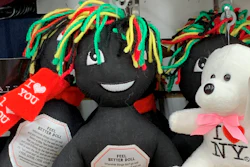 This undated photo provided by New Jersey state Assemblywoman Angela McKnight shows three 'Feel Better Dolls' sharing the shelf with a stuffed animal bearing an 'I Love New York' message at a One Dollar Zone store in Bayonne, N.J. The black rag 'Feel Better' dolls that came with instructions to 'find a wall' and slam the toy against it have been pulled from three stores after customers and the lawmaker said they were offensive.