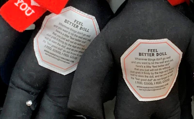 This undated photo provided by New Jersey state Assemblywoman Angela McKnight shows 'Feel Better Dolls' on the shelf of a One Dollar Zone store in Bayonne, N.J. The black rag dolls that came with instructions to 'find a wall' and slam the toy against it have been pulled from three stores after customers and the lawmaker said they were offensive.