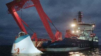 In this Nov. 19, 1994 file photo, the bow door of the sunken passenger ferry M/S Estonia is lifted up from the bottom of the sea, off Uto Island, in the Baltic Sea, near Finland.