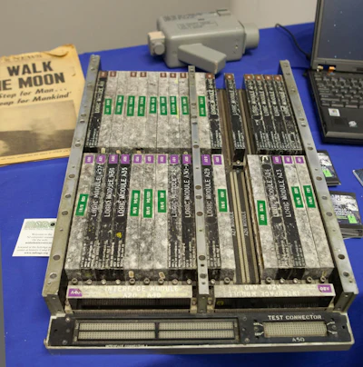 The Apollo Guidance Computer next to a laptop computer.