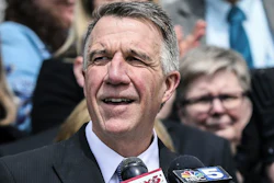 In this April 11, 2018, file photo, Vermont Gov. Phil Scott speaks before signing a bill on the steps of the Statehouse in Montpelier, Vt.
