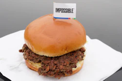 This Jan. 11, 2019, file photo shows the Impossible Burger, a plant-based burger containing wheat protein, coconut oil and potato protein among it's ingredients in Bellevue, Neb. After months of shortages, Impossible Foods is partnering with a veteran food production company to ramp up supplies of its popular plant-based burgers.