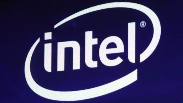 In this Oct. 3, 2018, file photo the Intel logo appears on a screen at the Nasdaq MarketSite, in New York's Times Square. Apple is paying Intel $1 billion for the chip maker's smartphone modem division in a deal driven by the upcoming transition to the next generation of wireless technology.