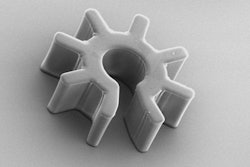 Scanning electron microscopy image of a 'cogwheel-shaped' optoelectronic microrobot. A mammalian cell or another sub-mm payload is scooped up into the central chamber of the robot, which is then manipulated away from the bulk suspension for analysis.