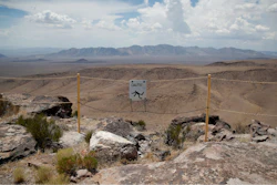 In this July 14, 2018, file photo, a sign warns of a falling danger on the crest of Yucca Mountain during a congressional tour near Mercury, Nev. Nevada's governor and congressional delegation say recent earthquakes should make the U.S. Energy Department look again at seismic risks at a site eyed as the place to bury the nation's nuclear waste, Wednesday, July 17, 2019.