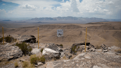 In this July 14, 2018, file photo, a sign warns of a falling danger on the crest of Yucca Mountain during a congressional tour near Mercury, Nev. Nevada's governor and congressional delegation say recent earthquakes should make the U.S. Energy Department look again at seismic risks at a site eyed as the place to bury the nation's nuclear waste, Wednesday, July 17, 2019.