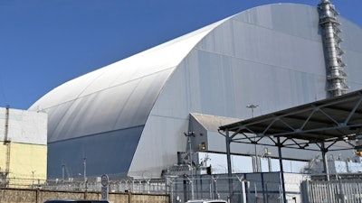 This June 1, 2019, file photo shows a view of the New Safe Confinement (NSC) movable enclosure at the nuclear power plant in Chernobyl, Ukraine. A new structure built to confine the Chernobyl nuclear reactor at the center of the world's worst nuclear disaster has been previewed for the media.