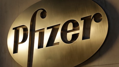 In this Nov. 23, 2015, file photo, the Pfizer logo is displayed at world headquarters in New York. Pfizer is buying Mylan in an all-stock deal and combining the generic pharmaceutical company with its off-patent branded and generic established medicines business.