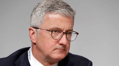 In this Thursday, May 3, 2018 file photo, Rupert Stadler, then CEO of Audi AG, attends the shareholders' meeting of the Volkswagen stock company in Berlin, Germany. German prosecutors announced Wednesday July 31, 2019, that they have charged Rupert Stadler and three other individuals with fraud in connection with sales of diesel cars with software that enabled cheating on emissions tests.