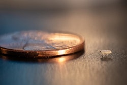 A micro-bristle-bot is shown next to a US penny for size comparison.
