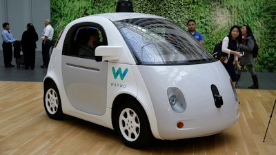 In this Dec. 13, 2016, file photo, the Waymo driverless car is displayed during a Google event in San Francisco. Dozens of city employees in Chandler, Ariz., will be able to use self-driving vehicles at work in partnership with Waymo, an autonomous vehicle company. The Arizona Republic reports on July 1, 2019, the partnership will begin this month as the Arizona city evaluates whether use of the autonomous vehicles cut costs to maintain and operate its vehicle fleet and boosts employee productivity.
