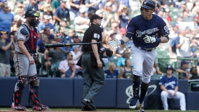 Milwaukee Brewers' Christian Yelich hits a home run during the sixth inning of a baseball game against the Atlanta Braves Wednesday, July 17, 2019, in Milwaukee.
