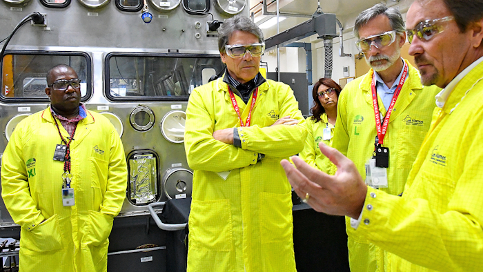 In this May 10, 2017, file photo, U.S. Secretary of Energy Rick Perry, second from left, at the Los Alamos Laboratory Plutonium Facility in Los Alamos, N.M.