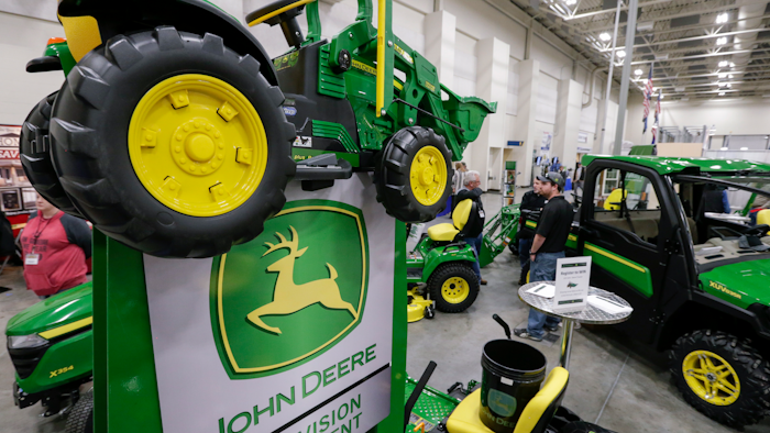 In this Feb. 23, 2018, file photo, John Deere products on display at a home and garden trade show in Council Bluffs, Iowa.