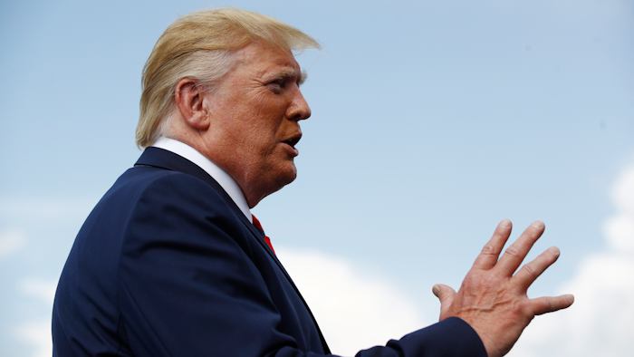 President Donald Trump speaks with reporters before boarding Air Force One at Morristown Municipal Airport in Morristown, N.J., Sunday, Aug. 18, 2019.