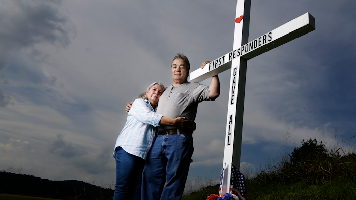 Ansol and Janie Clark pose near the Kingston Fossil Plant in Kingston, Tenn., Aug. 6, 2019.