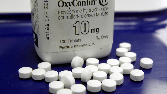This Feb. 19, 2013, file photo shows OxyContin pills arranged for a photo at a pharmacy in Montpelier, Vt.