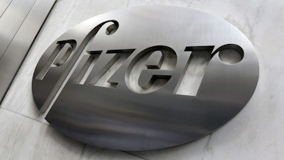 This Dec. 4, 2017, file photo shows the Pfizer company logo at the company's headquarters in New York.