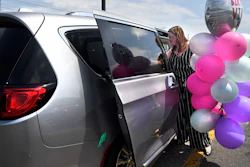 In this Tuesday, July 16, 2019, Melanie Matcheson loads balloons into her Chrysler Pacifica in Southington, Conn.