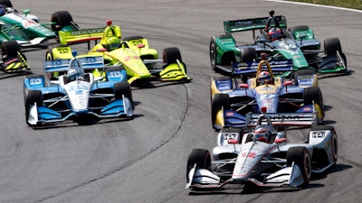 Will Power (12) leads Alexander Rossi (27) and Josef Newgarden (2) at the start of an IndyCar Series auto race, Sunday, July 28, 2019, at Mid-Ohio Sports Car Course in Lexington, Ohio.