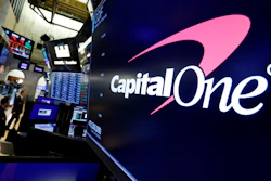 In this Tuesday, July 30, 2019, file photo, the logo for Capital One Financial appears above a trading post on the floor of the New York Stock Exchange.
