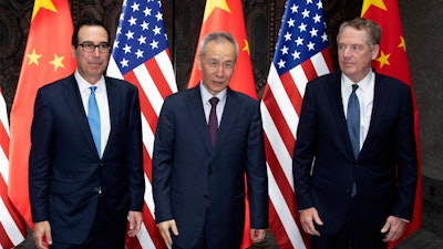 Chinese Vice Premier Liu He, center, with U.S. Trade Representative Robert Lighthizer, right, and Treasury Secretary Steven Mnuchin at the Xijiao Conference Center in Shanghai, Wednesday, July 31, 2019.