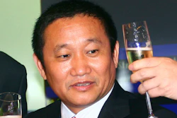 In this May 8, 2009, file photo, Liu Zhongtian, chairman of China Zhongwang Holdings Limited, celebrates at the company's listing ceremony in the Hong Kong Stock Exchange.
