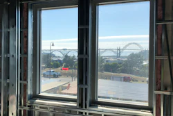 In this July 22, 2019, photo, the Yaquina Bay Bridge seen through the window of Oregon State University's Marine Studies Building, which is being erected in a tsunami inundation zone in Newport, Ore.